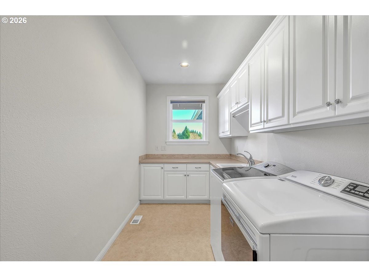 34043 Bennett Road Warren, OR 97053 - Photo 38 of 46 a kitchen that has a sink and a stove in it