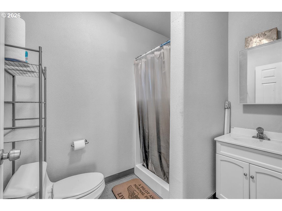 34043 Bennett Road Warren, OR 97053 - Photo 45 of 46 a bathroom with a sink and a mirror