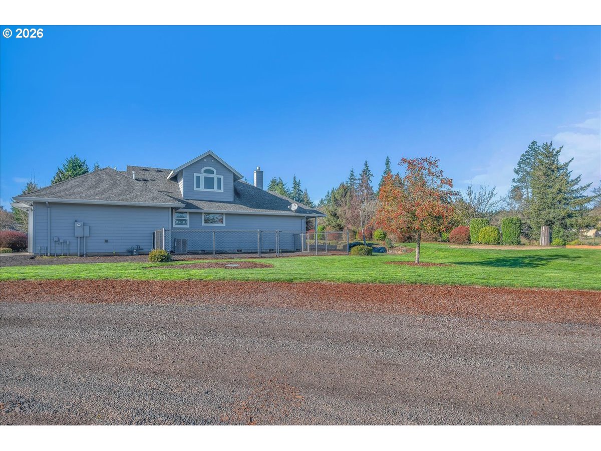 34043 Bennett Road Warren, OR 97053 - Photo 5 of 46 a front view of a house with a yard and garage