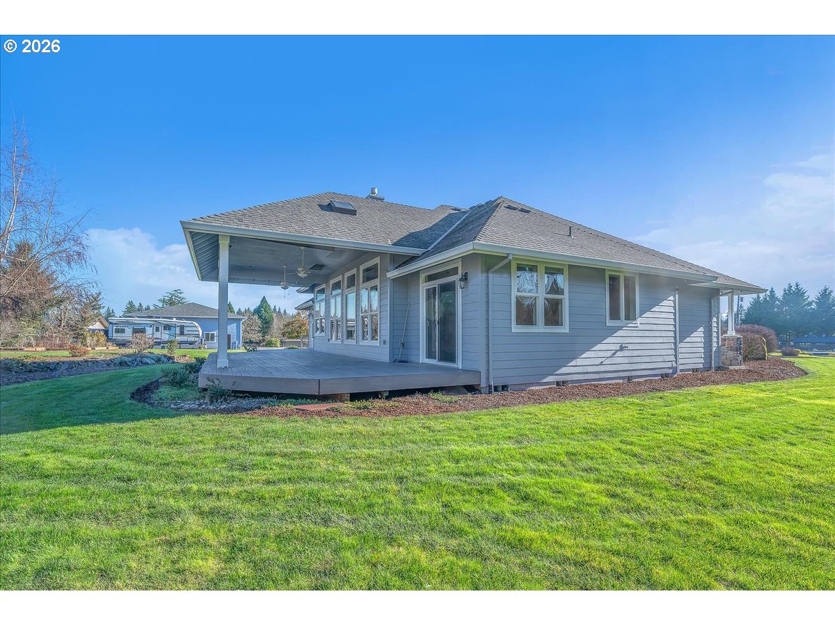 34043 Bennett Road Warren, OR 97053 - Photo 6 of 46 a front view of a house with a garden