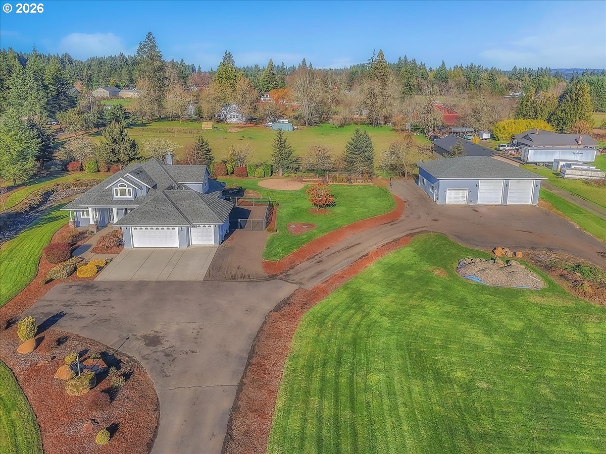 34043 Bennett Road Warren, OR 97053 - Photo 9 of 46 an aerial view of a house with outdoor space and a lake view