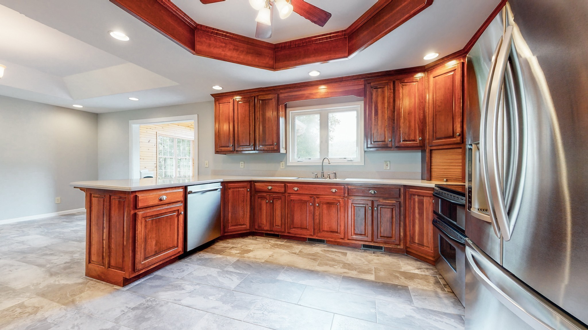656 Greenvale Road Milton, TN 37118 - Photo 12 of 43 a kitchen with stainless steel appliances granite countertop a refrigerator a sink a stove a microwave and island