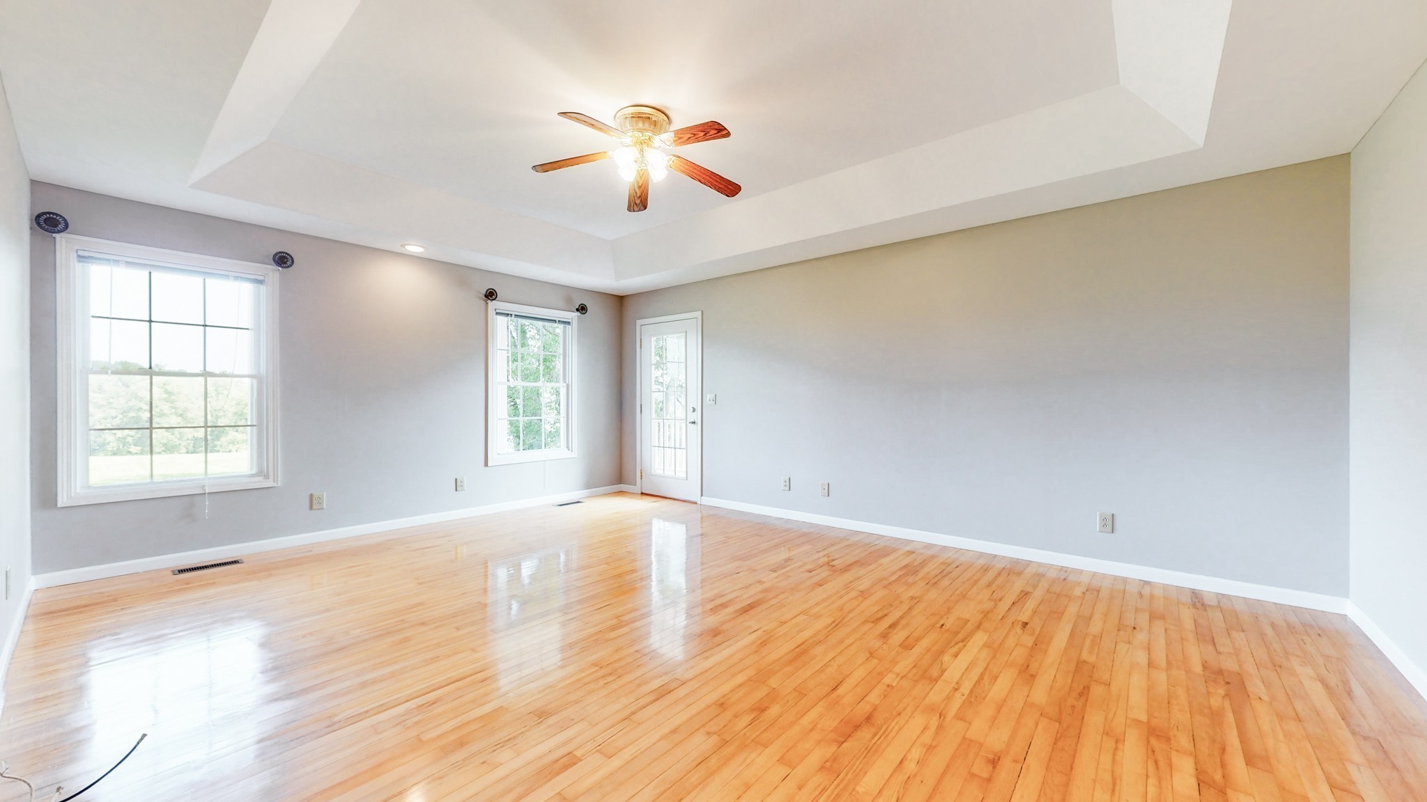 656 Greenvale Road Milton, TN 37118 - Photo 16 of 43 a view of empty room with wooden floor and fan