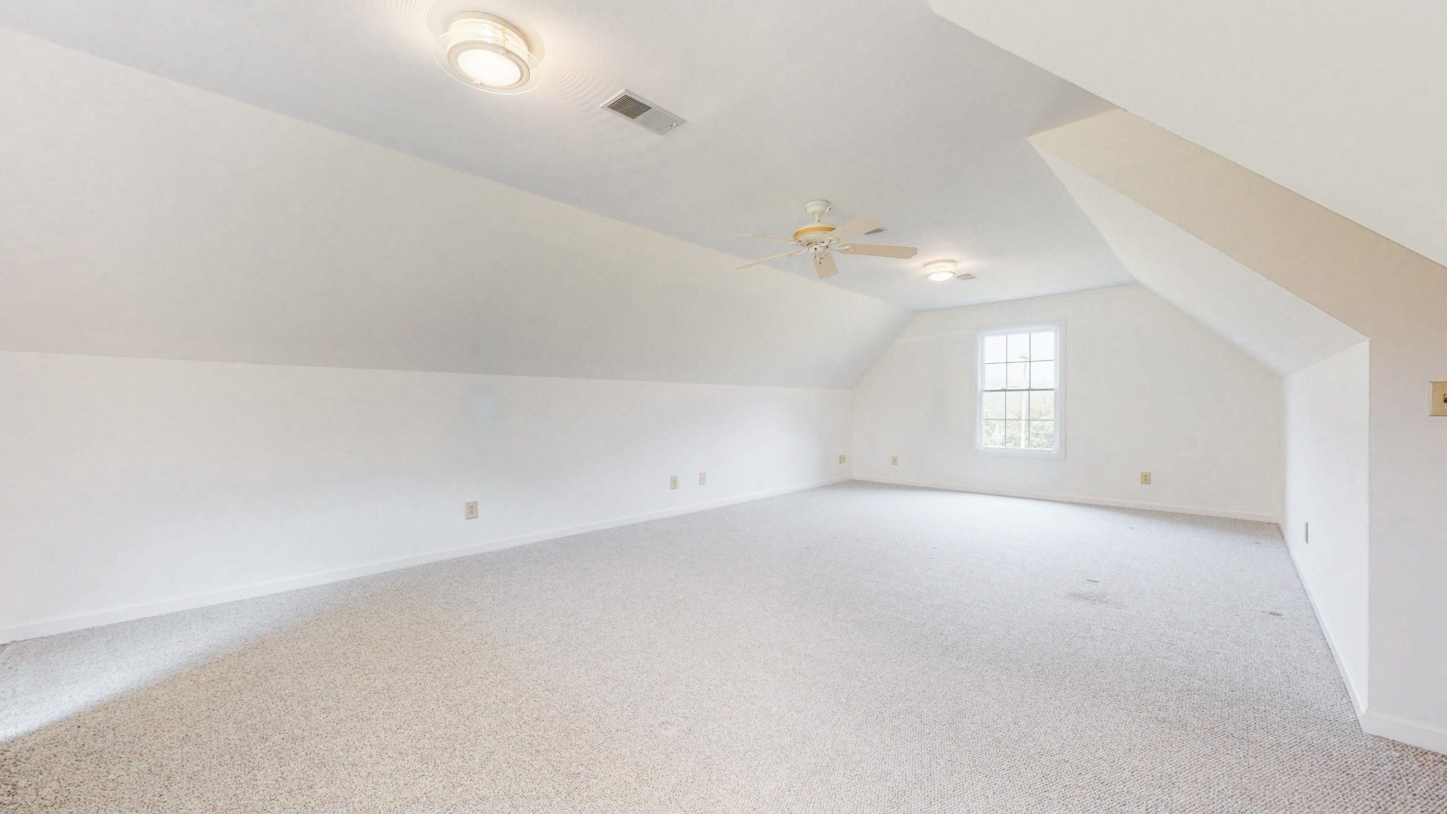 656 Greenvale Road Milton, TN 37118 - Photo 29 of 43 an empty room with windows and chandelier fan