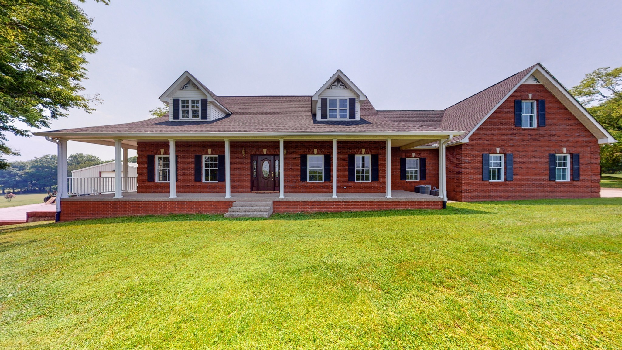 656 Greenvale Road Milton, TN 37118 - Photo 4 of 43 a front view of a house with garden