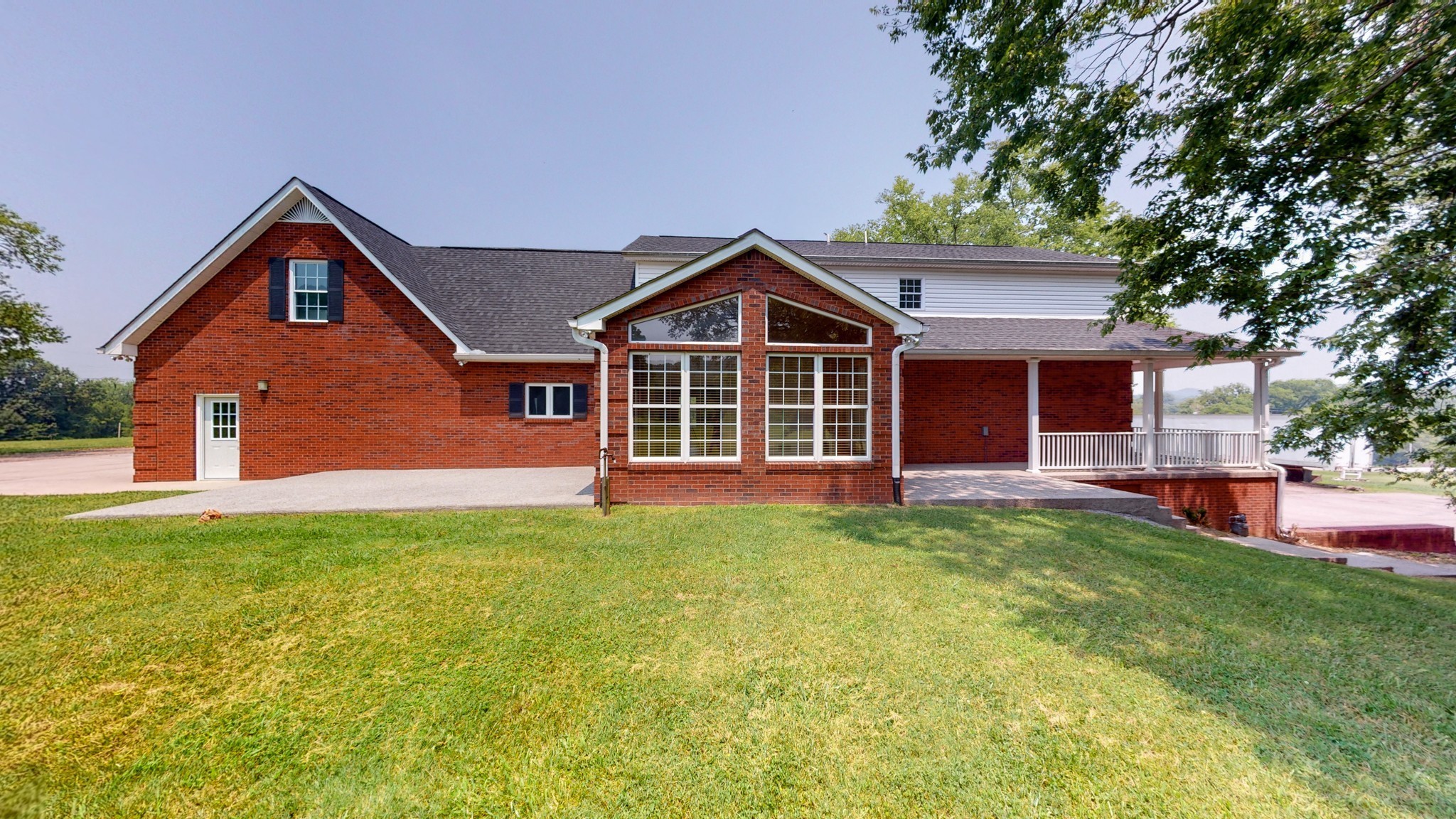 656 Greenvale Road Milton, TN 37118 - Photo 34 of 43 a front view of a house with a garden and porch