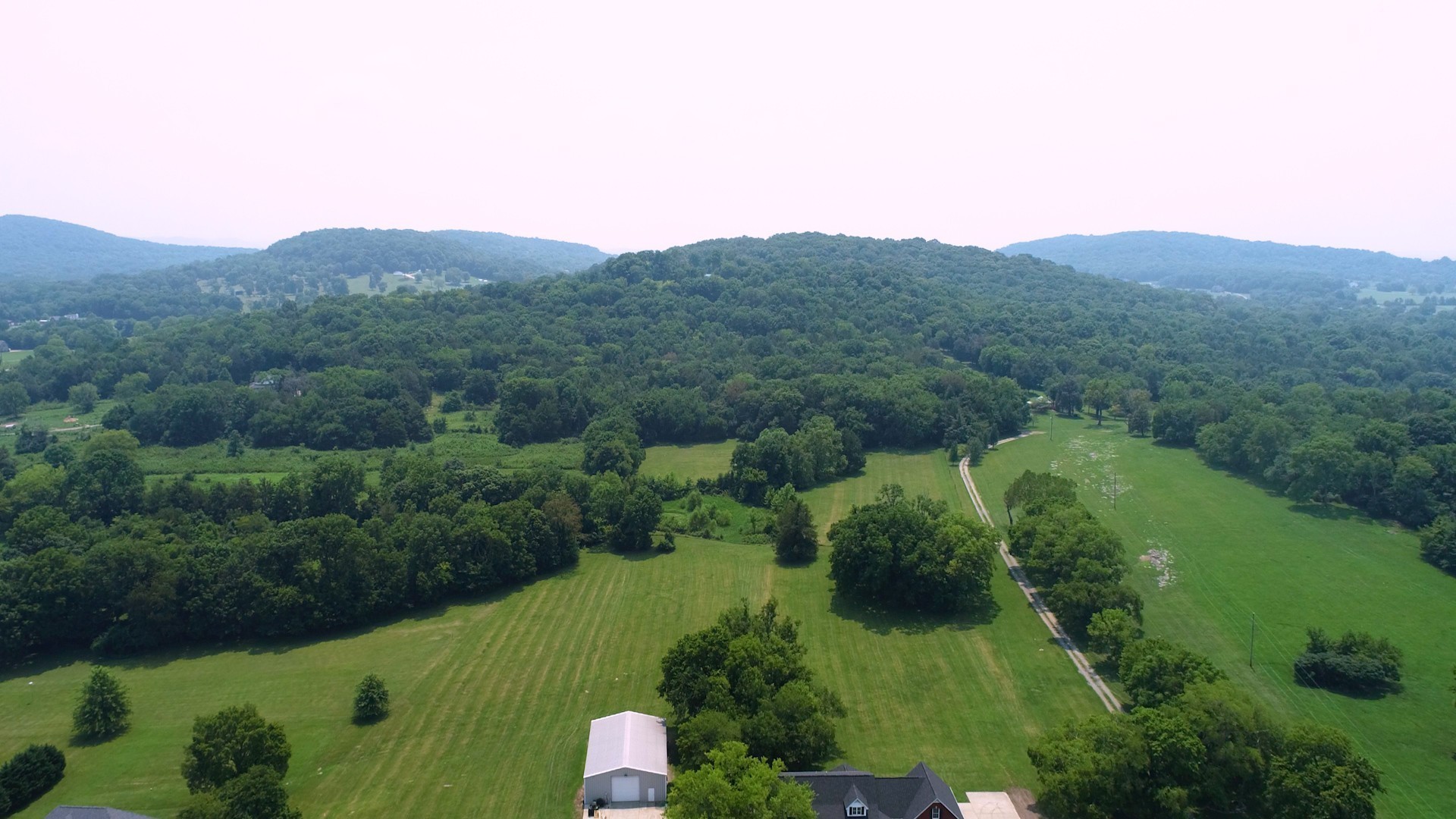 656 Greenvale Road Milton, TN 37118 - Photo 43 of 43 an aerial view of houses covered in trees