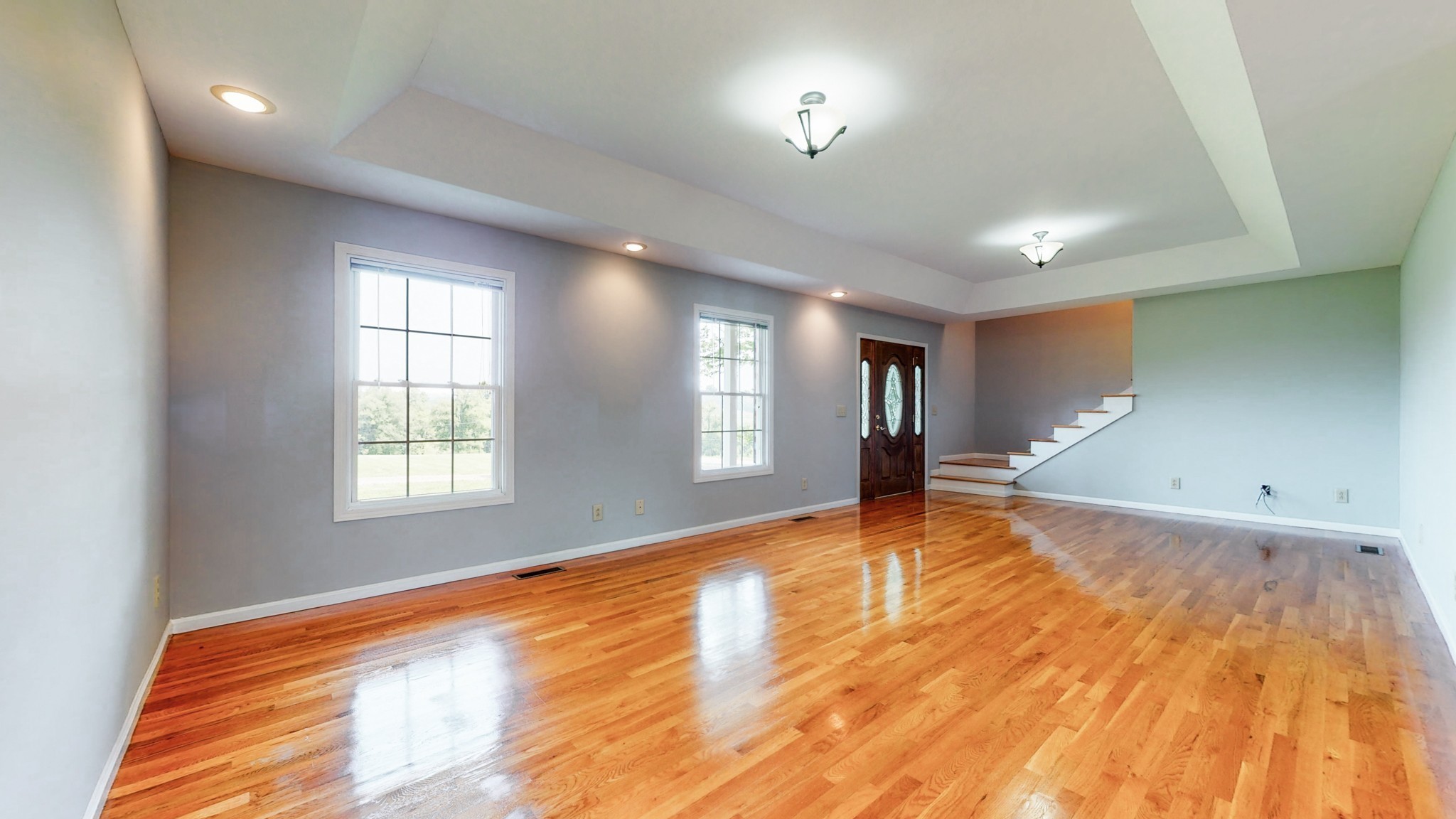 656 Greenvale Road Milton, TN 37118 - Photo 6 of 43 an empty room with wooden floor and windows