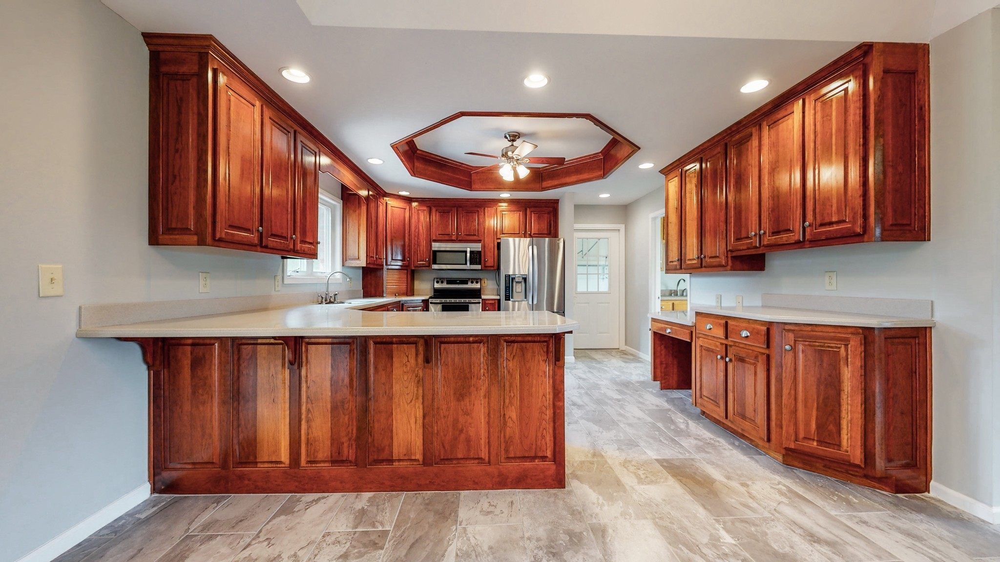 656 Greenvale Road Milton, TN 37118 - Photo 10 of 43 a kitchen with stainless steel appliances granite countertop wooden cabinets a stove a sink and a refrigerator