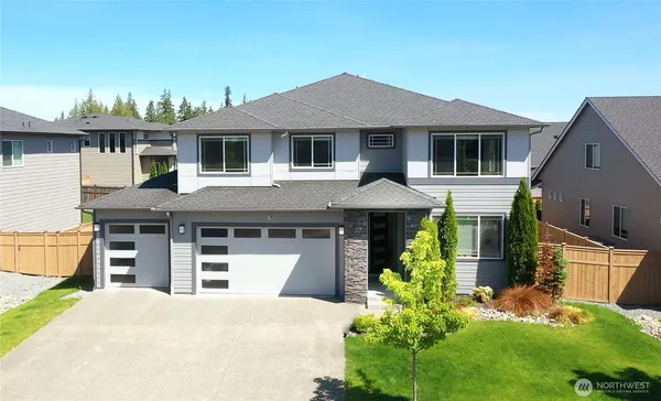 front view of a house with a yard