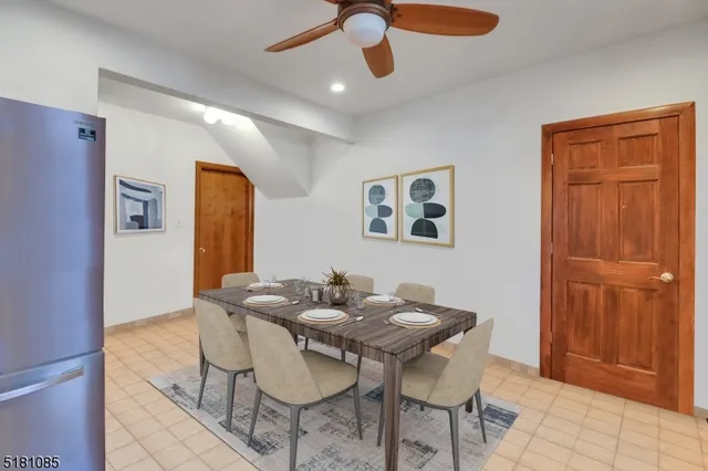a view of a dining room with furniture and chandelier