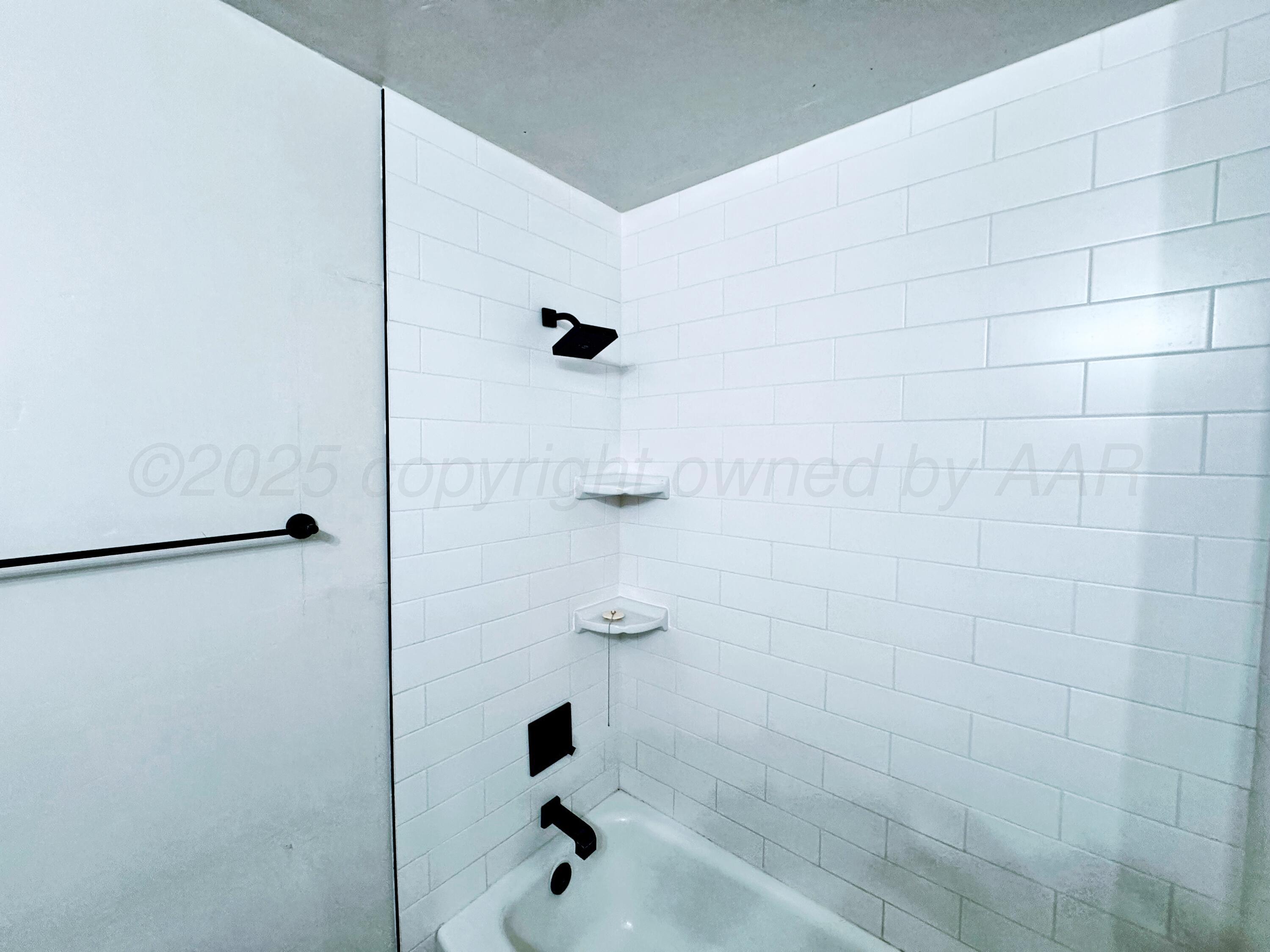 2214 Harvard Drive Perryton, TX 79070 - Photo 9 of 20 a bathroom with a shower