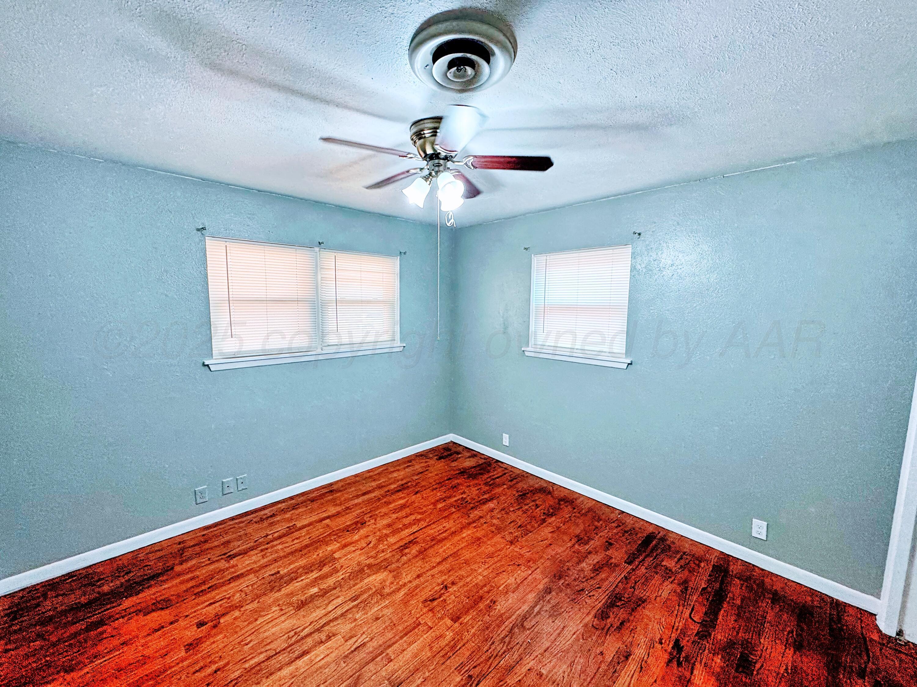 2214 Harvard Drive Perryton, TX 79070 - Photo 10 of 20 a view of room with window and ceiling fan