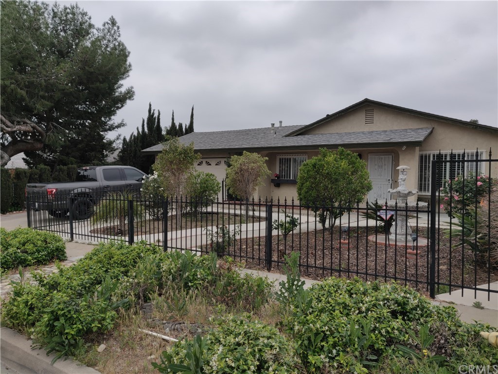 8512 Hyacinth Street Rancho Cucamonga, CA 91730 - Photo 1 of 1 a view of a house with a small yard and plants