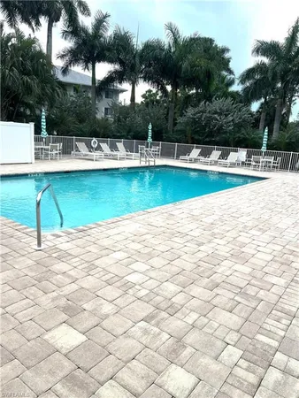 a view of a swimming pool with a yard