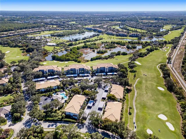 an aerial view of a house with a swimming pool yard and outdoor seating