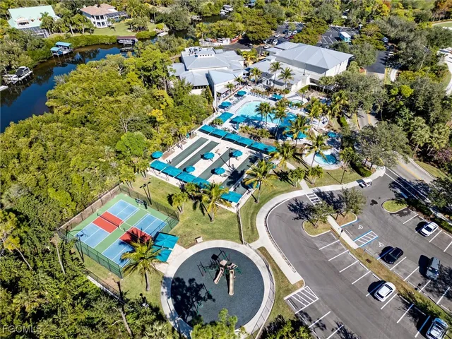 an aerial view of a house with a swimming pool yard and outdoor seating