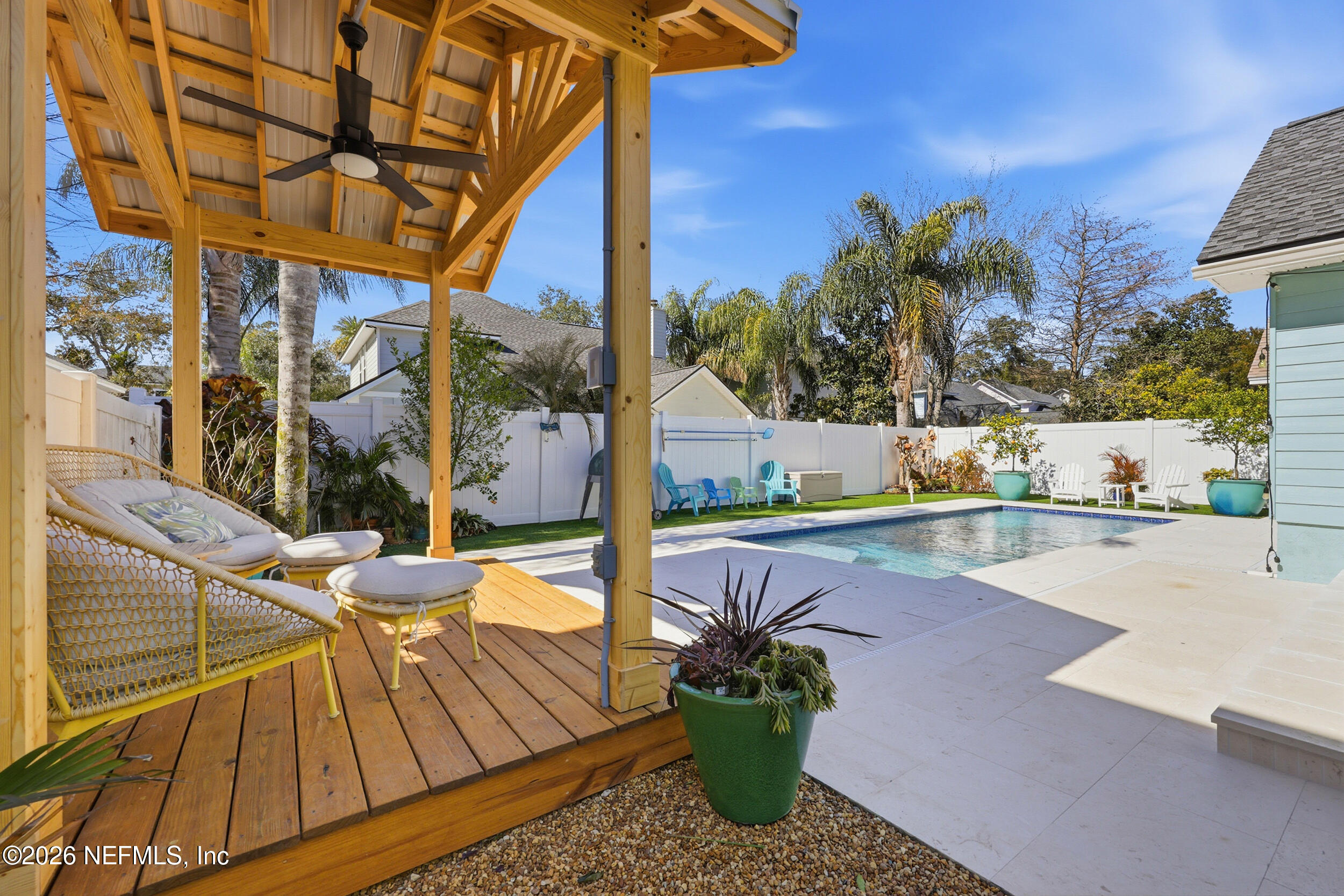 a view of a swimming pool with a patio