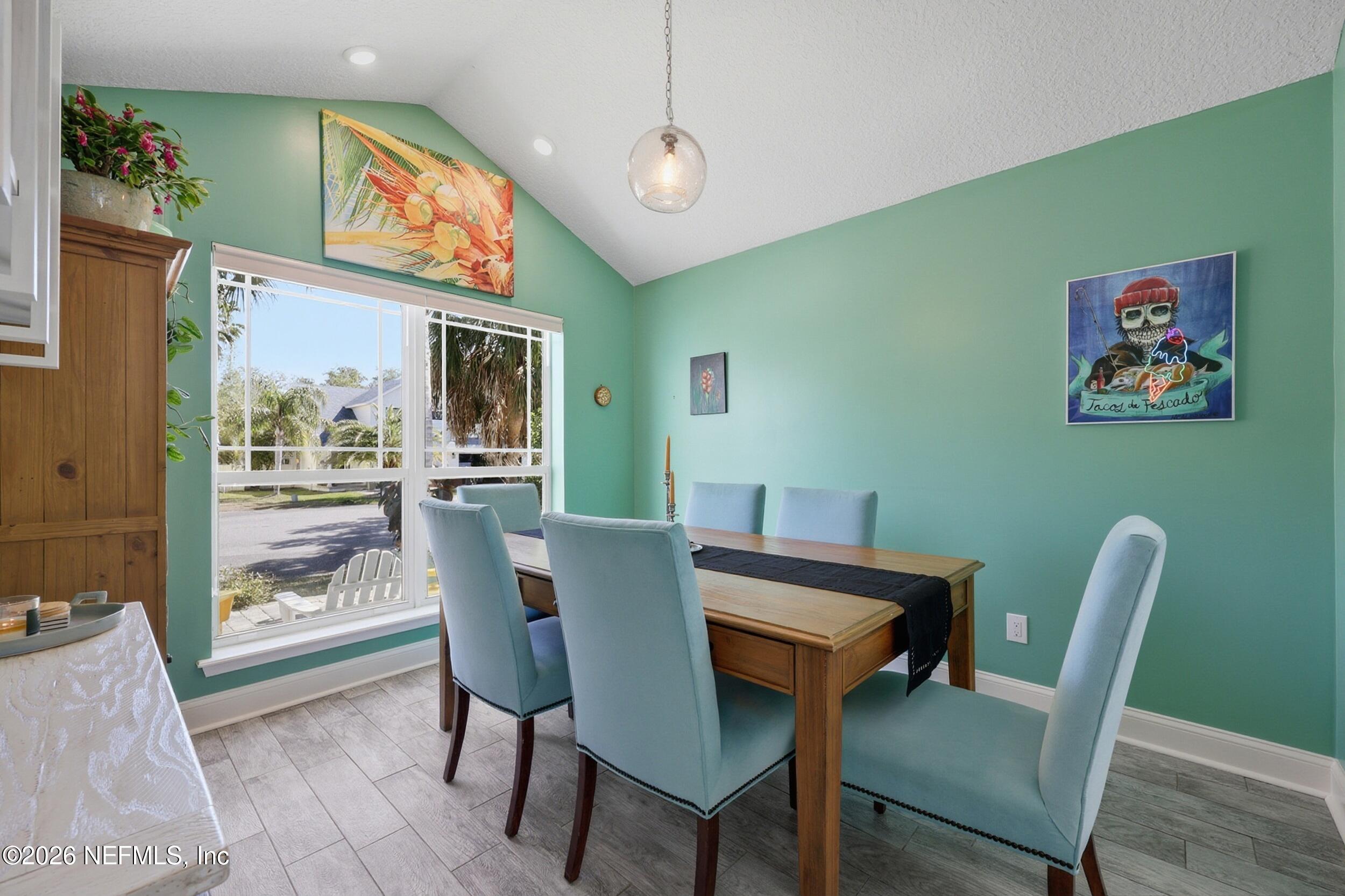 1472 Laurel Way Atlantic Beach, FL 32233 - Photo 11 of 42 a view of a dining room with furniture window and wooden floor