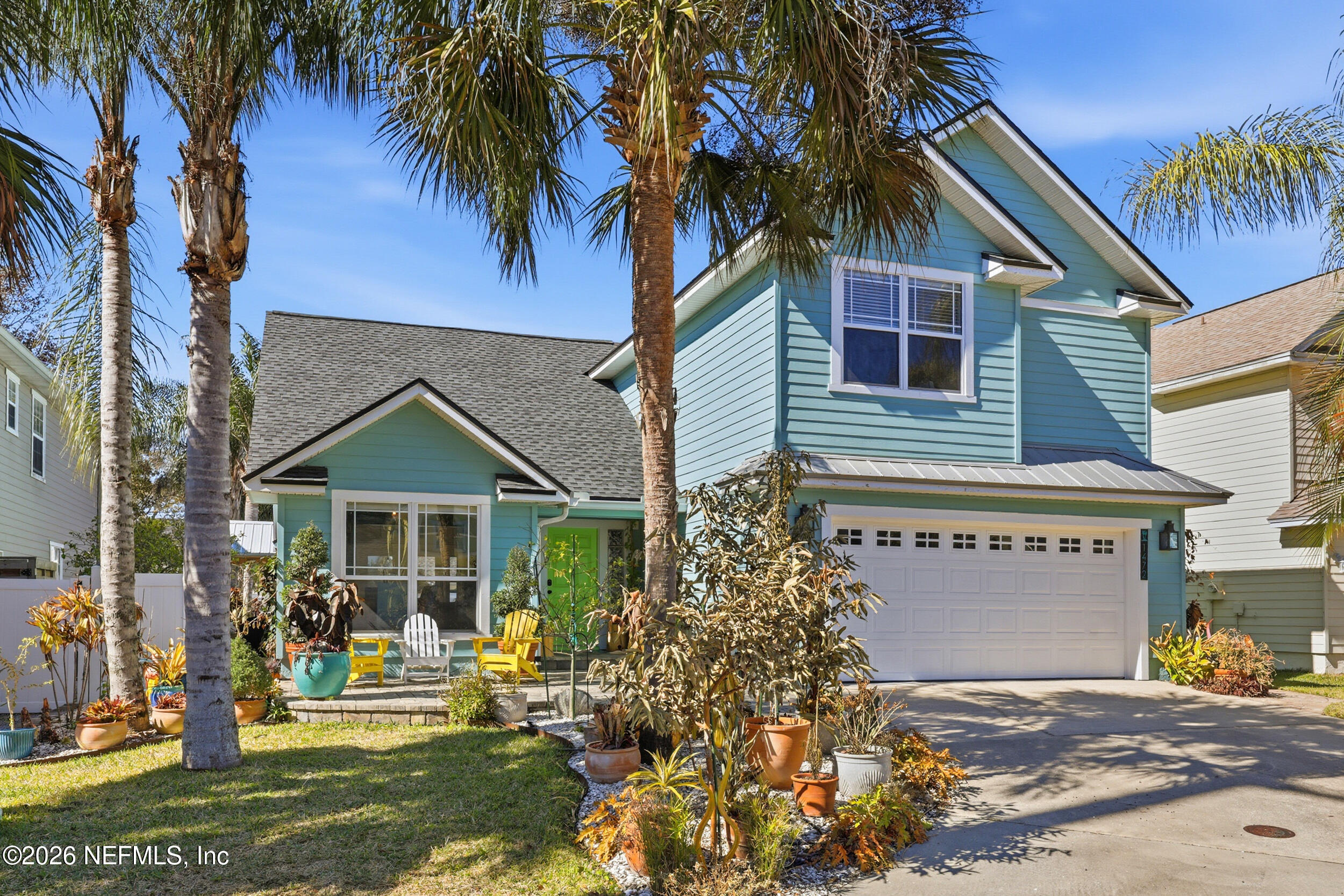 1472 Laurel Way Atlantic Beach, FL 32233 - Photo 2 of 42 a front view of a house with a yard