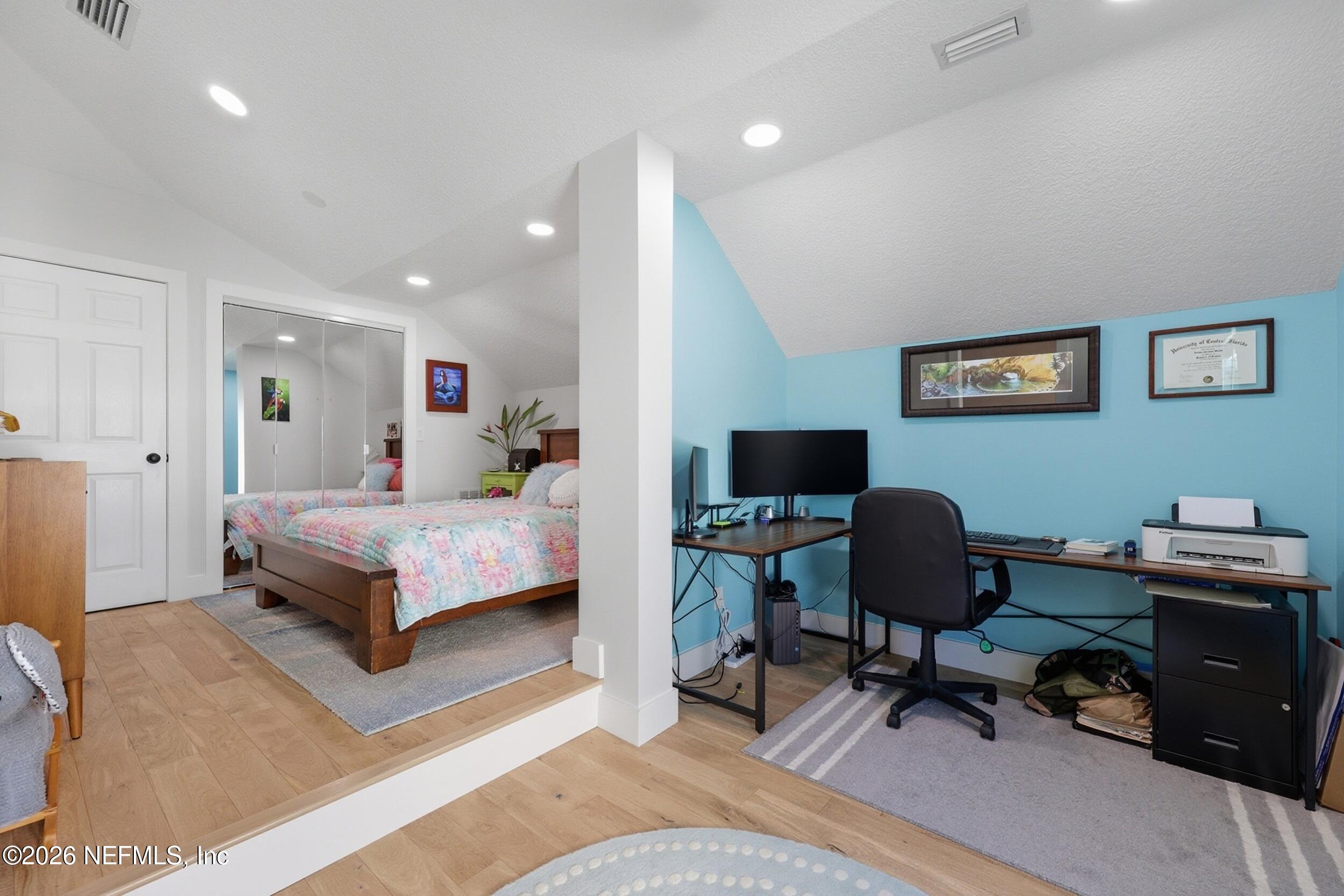 1472 Laurel Way Atlantic Beach, FL 32233 - Photo 24 of 42 a bedroom with a bed a desk and chair