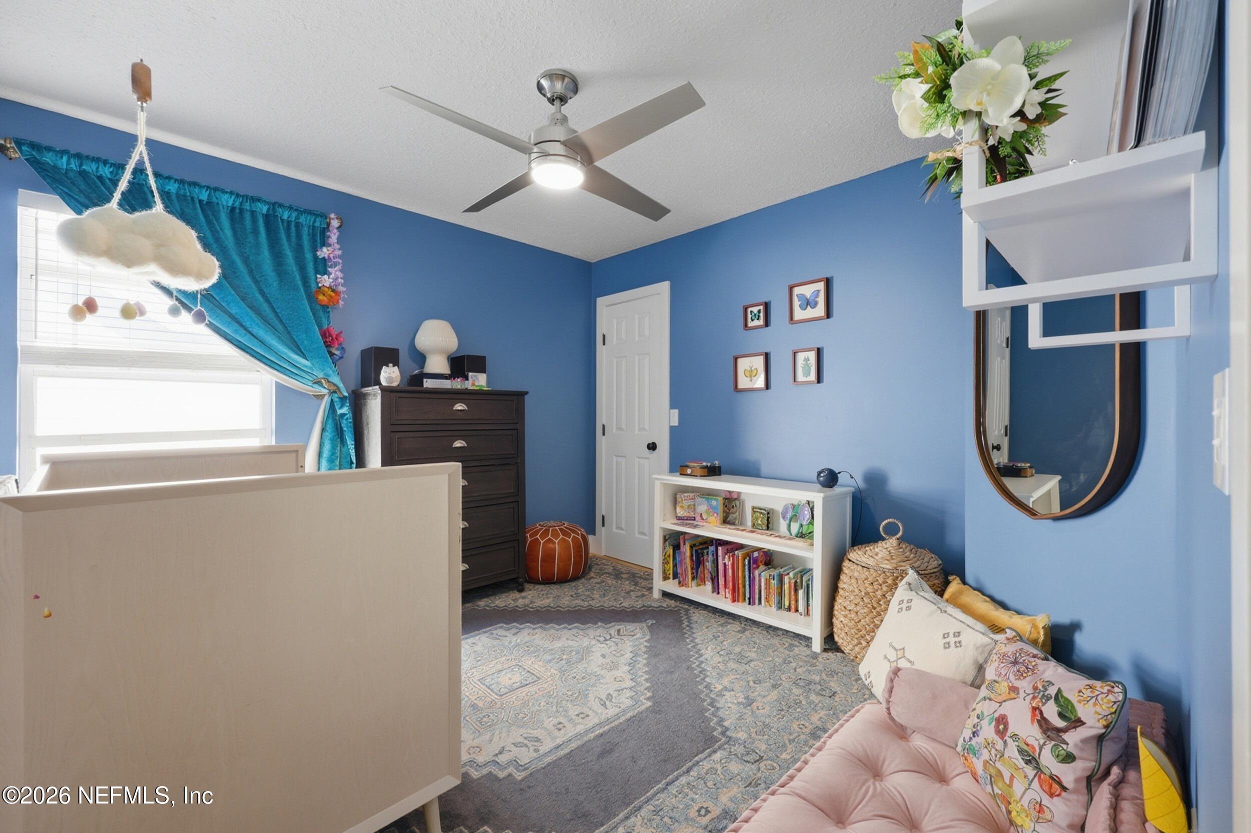 1472 Laurel Way Atlantic Beach, FL 32233 - Photo 29 of 42 a living room with furniture and a window