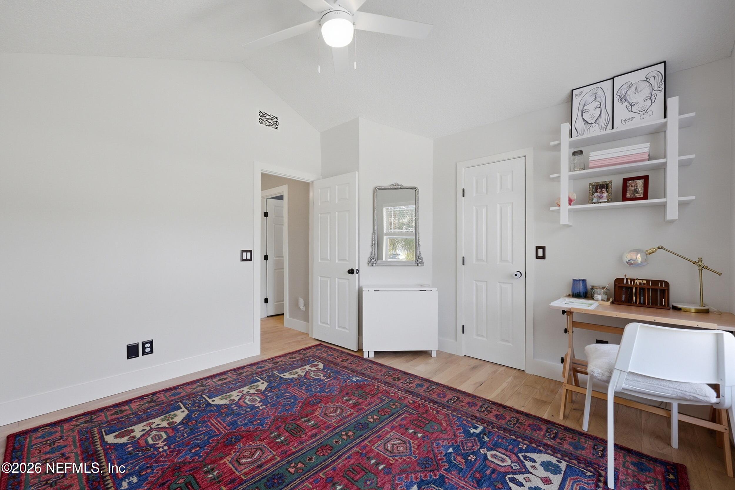 1472 Laurel Way Atlantic Beach, FL 32233 - Photo 32 of 42 a view of a bedroom with furniture and wooden floor