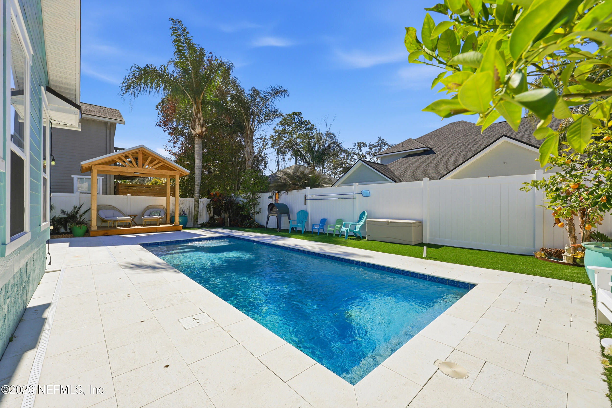 1472 Laurel Way Atlantic Beach, FL 32233 - Photo 36 of 42 a view of pool with lawn chairs and potted plants
