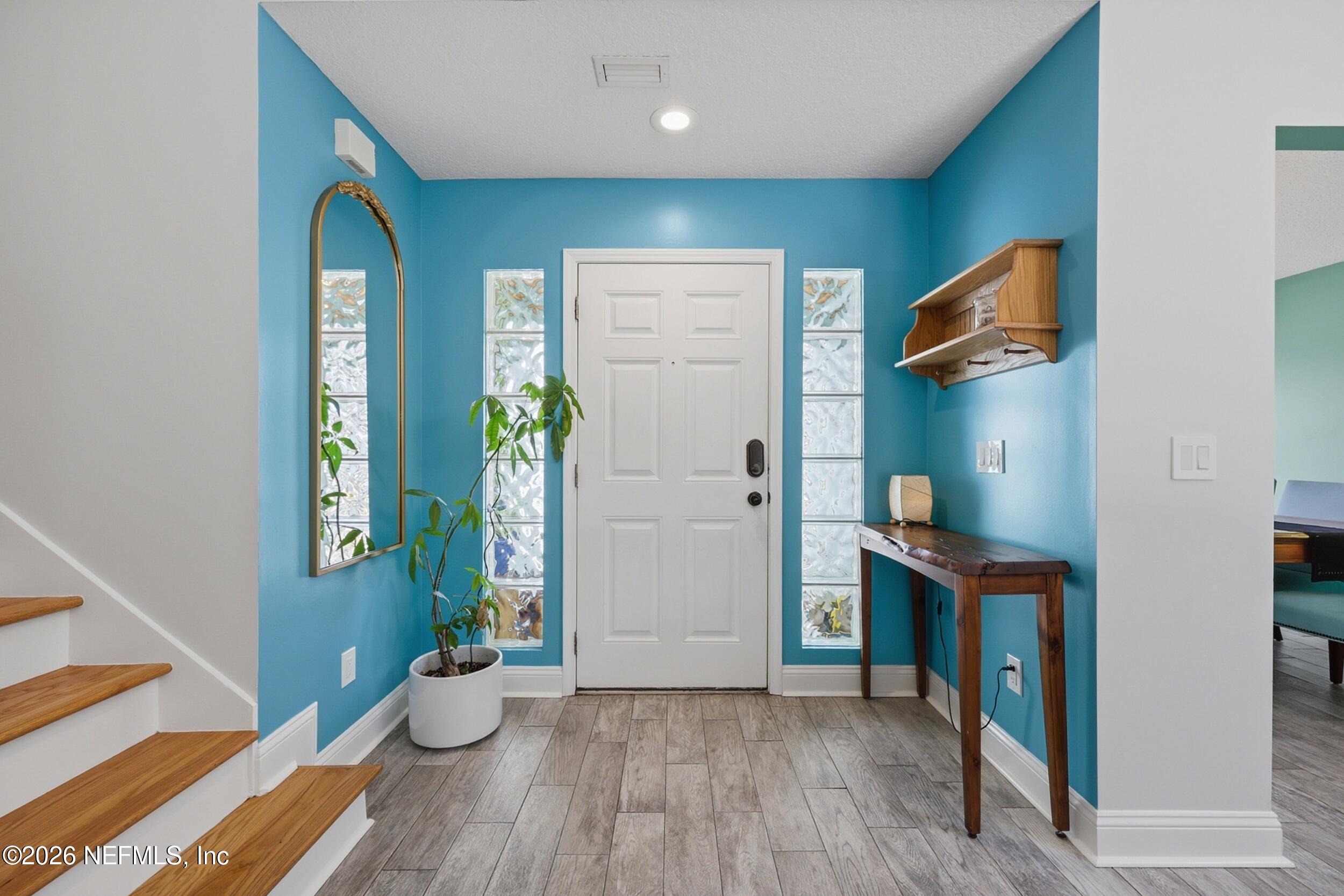 1472 Laurel Way Atlantic Beach, FL 32233 - Photo 5 of 42 a view of an entryway door and wooden floor