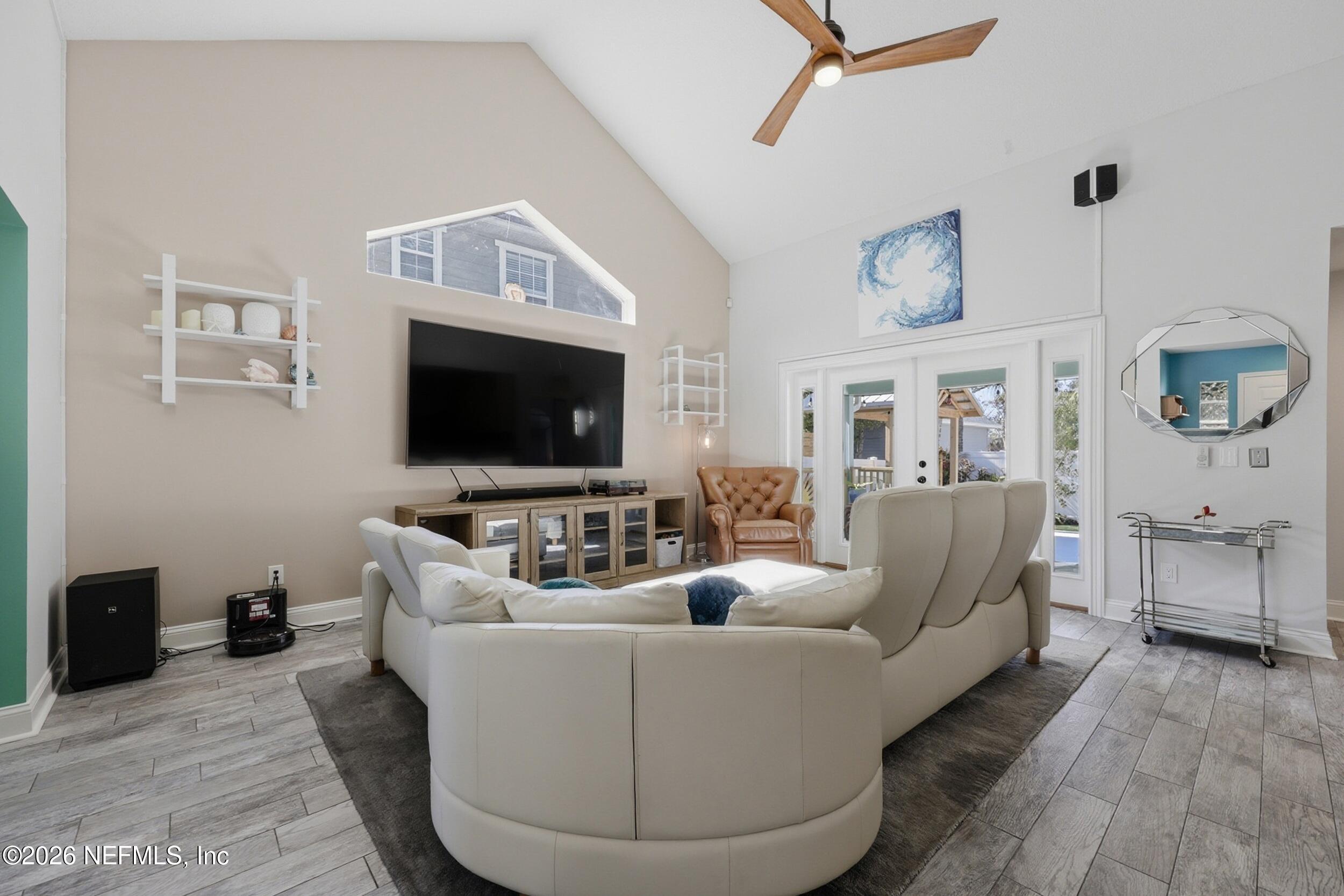1472 Laurel Way Atlantic Beach, FL 32233 - Photo 8 of 42 a living room with furniture and a flat screen tv