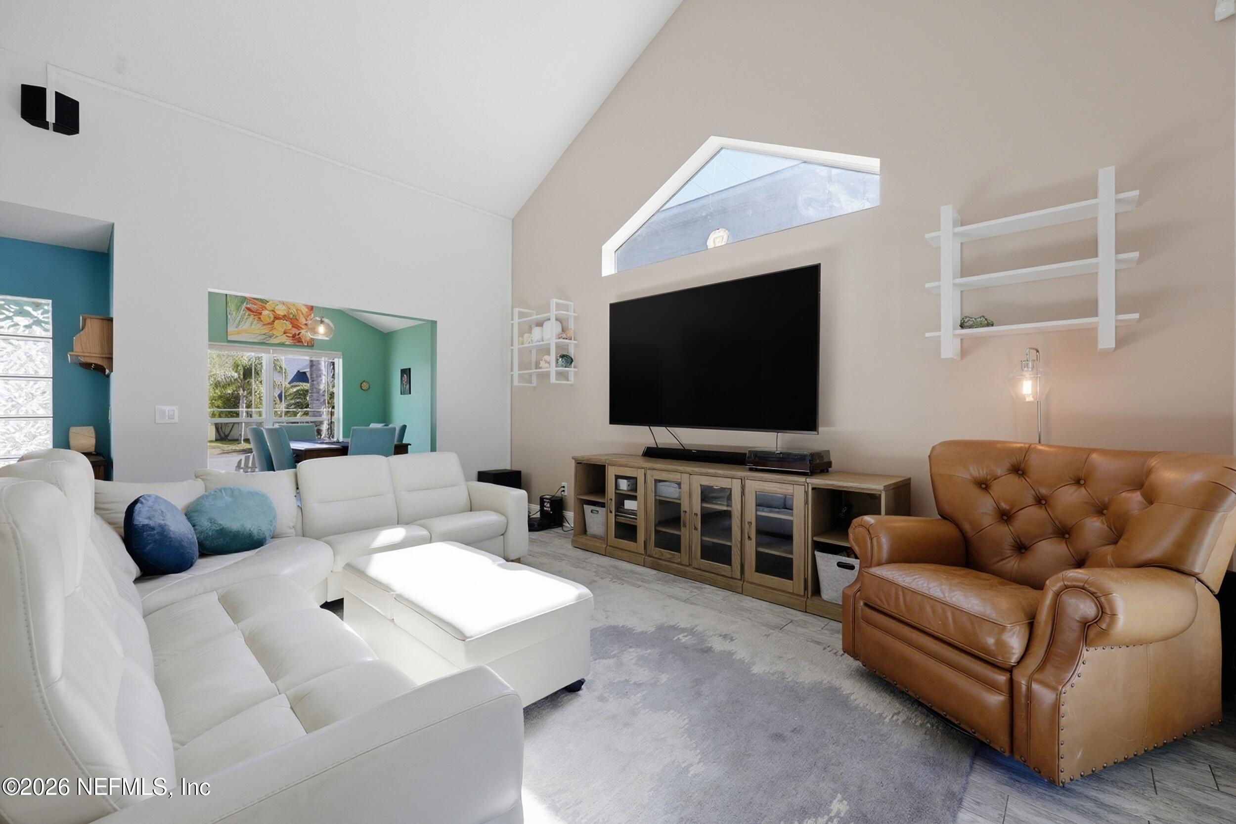 1472 Laurel Way Atlantic Beach, FL 32233 - Photo 9 of 42 a living room with furniture and a flat screen tv