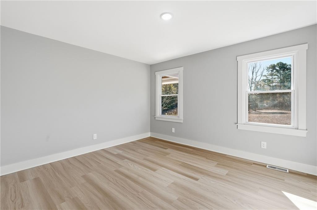 2185 Ridge Road Douglasville, GA 30134 - Photo 25 of 44 a view of an empty room with wooden floor and a window