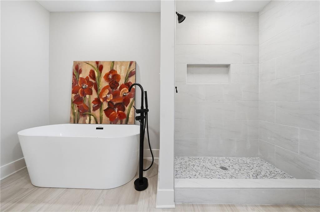 2185 Ridge Road Douglasville, GA 30134 - Photo 26 of 44 a white bath tub sitting in a bathroom