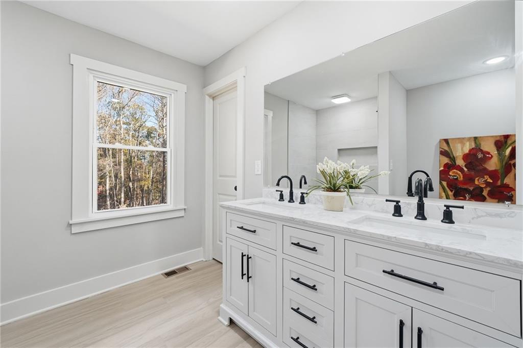 2185 Ridge Road Douglasville, GA 30134 - Photo 27 of 44 a bathroom with a granite countertop sink mirror double vanity