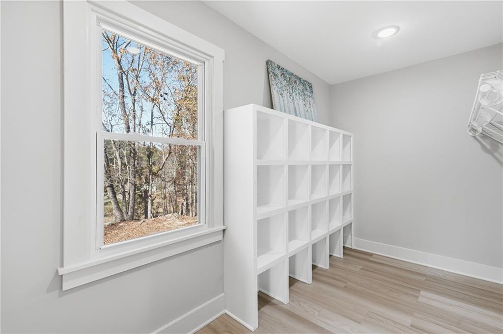 2185 Ridge Road Douglasville, GA 30134 - Photo 28 of 44 a view of an empty room with wooden floor and a window