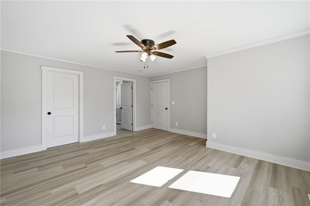 2185 Ridge Road Douglasville, GA 30134 - Photo 29 of 44 an empty room with wooden floor and windows