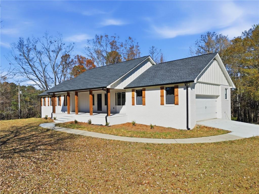 2185 Ridge Road Douglasville, GA 30134 - Photo 41 of 44 a house that has a tree in front of it