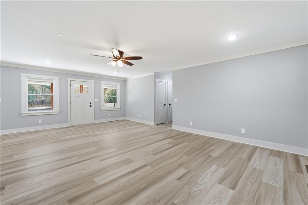 2185 Ridge Road Douglasville, GA 30134 - Photo 8 of 44 an empty room with wooden floor and windows