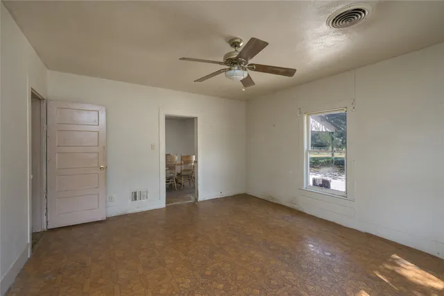 a view of an empty room with a window