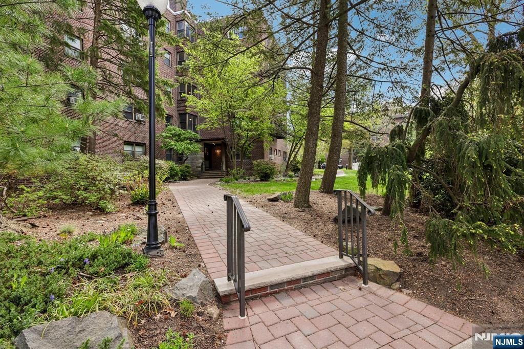3060 Edwin Avenue, Unit 3D Fort Lee, NJ 07024 - Photo 2 of 16 a view of a park with a tree