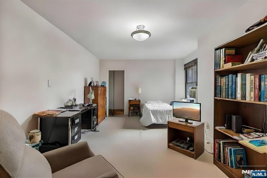 3060 Edwin Avenue, Unit 3D Fort Lee, NJ 07024 - Photo 6 of 16 a livingroom with workspace and a window