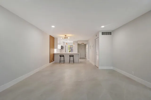 a view of work space with wooden floor and furniture