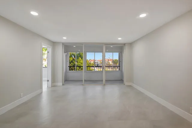an empty room with window and outdoor view