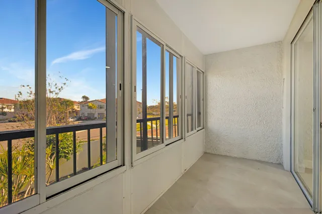 a view of an empty room with a large window