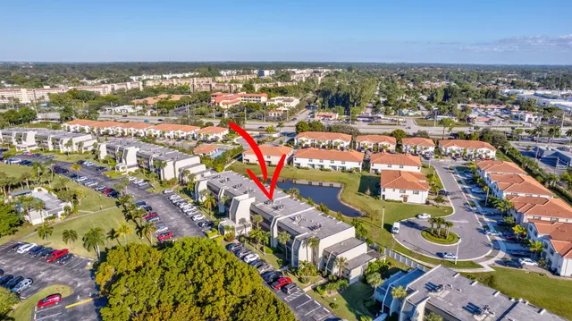 an aerial view of residential building with outdoor space and swimming pool