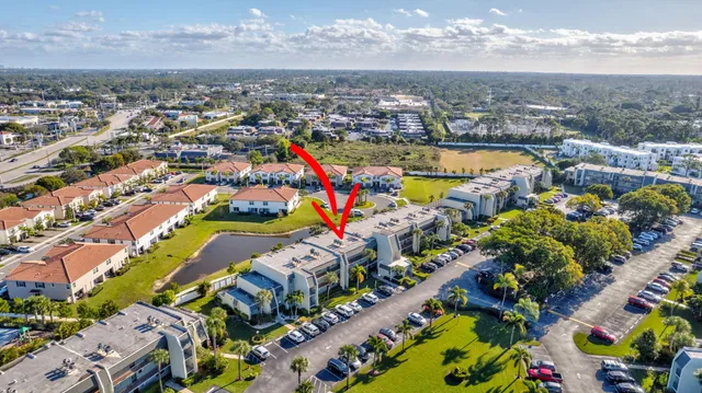 a view of a swimming pool with outdoor seating