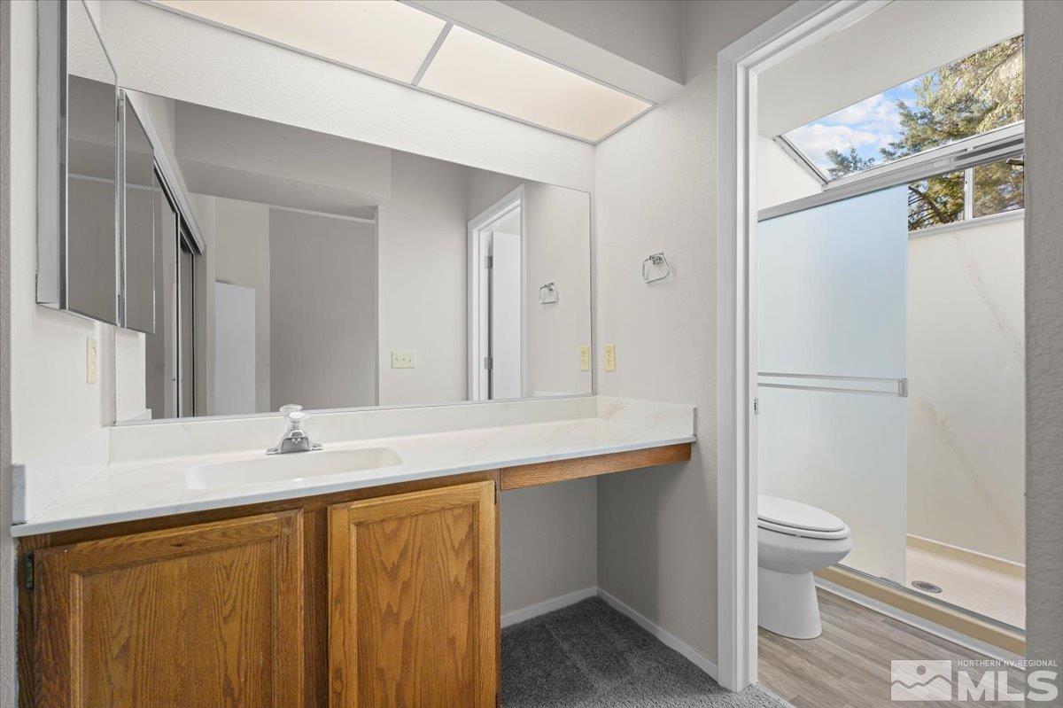 5154 Aspen View Drive Reno, NV 89523 - Photo 12 of 23 a bathroom with a sink a toilet and shower
