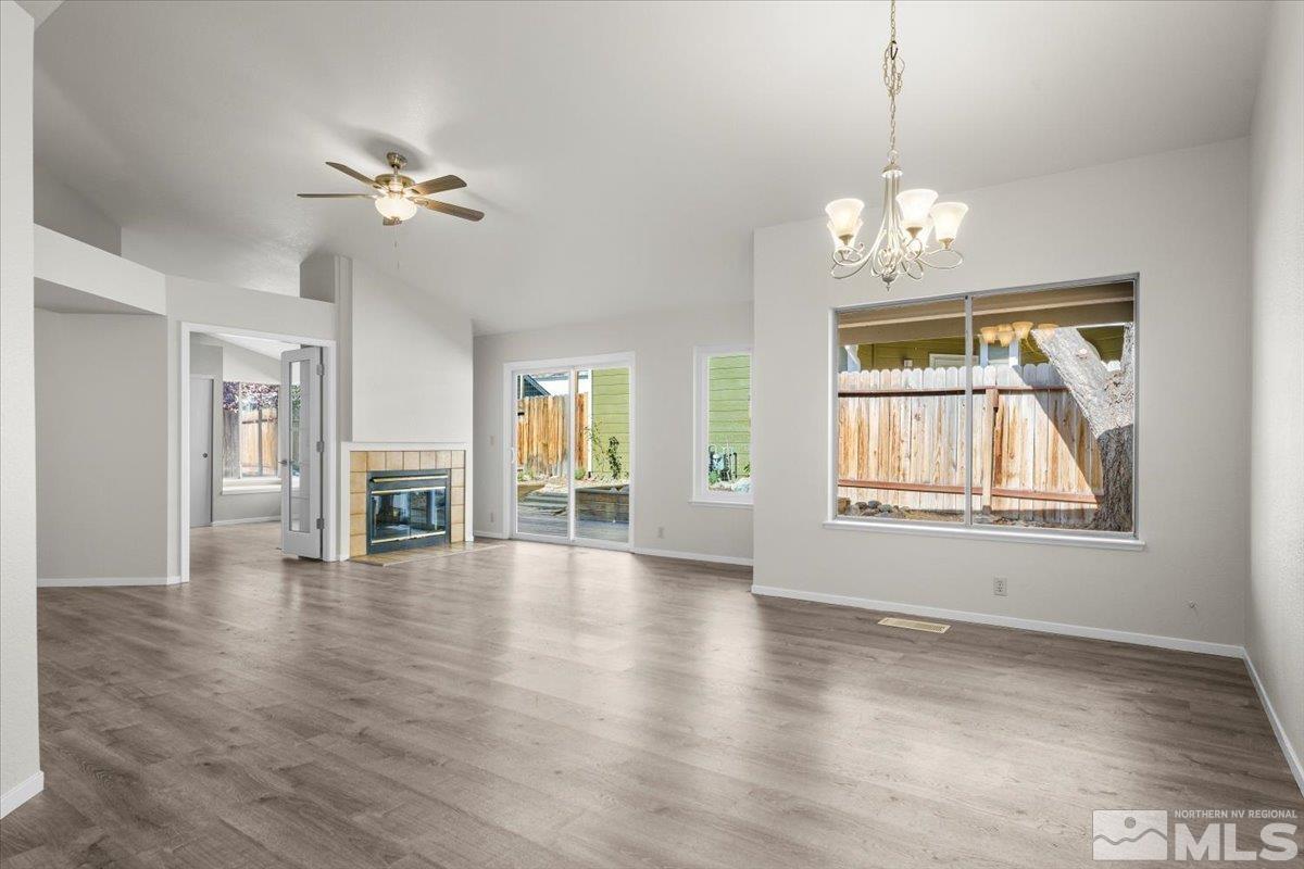 5154 Aspen View Drive Reno, NV 89523 - Photo 3 of 23 a view of an empty room with chandelier and wooden floor