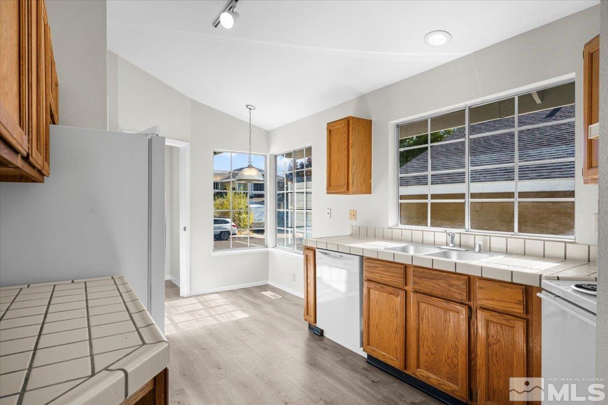 5154 Aspen View Drive Reno, NV 89523 - Photo 5 of 23 a kitchen with a sink stove and refrigerator