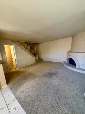 a kitchen with a sink a counter space and a stove top oven